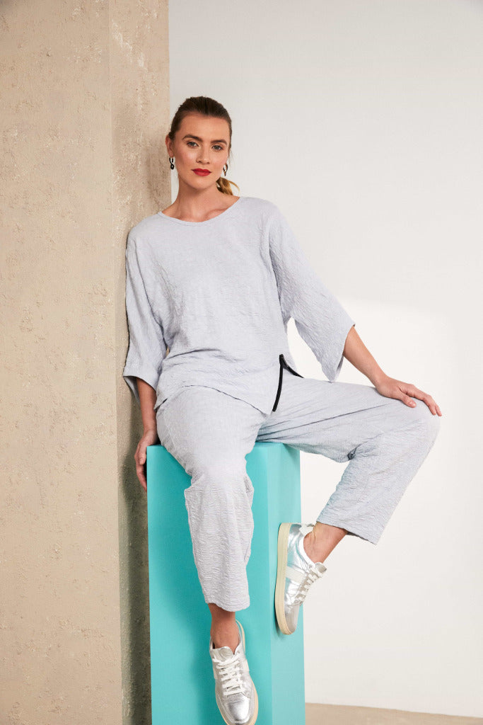 naya embossed crop trousers in silver (front)