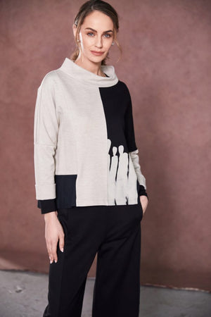 naya two tone funnel neck placement print top in black & sand