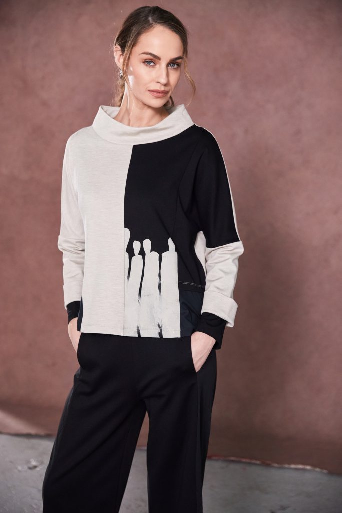 naya two tone funnel neck placement print top in black & sand