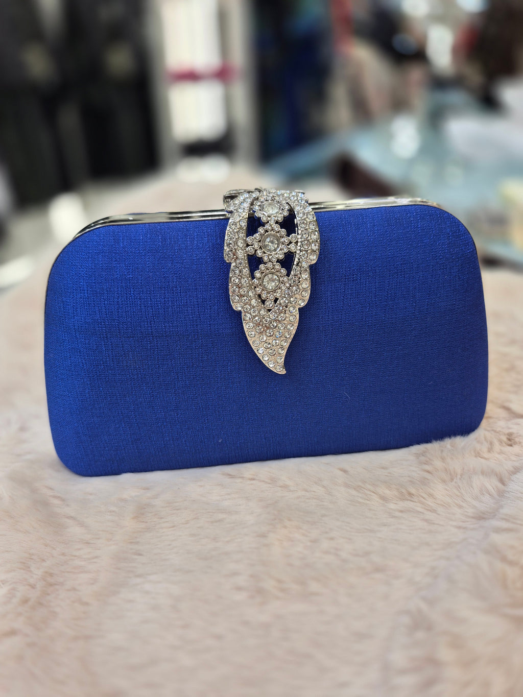 Diamante closure clutch in blue