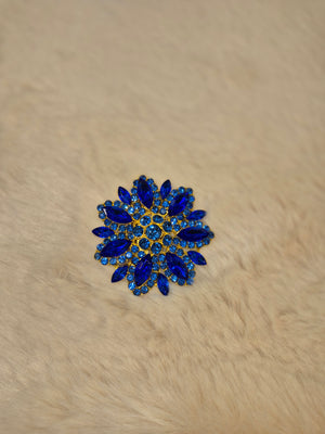 Diamante flower brooch in blue