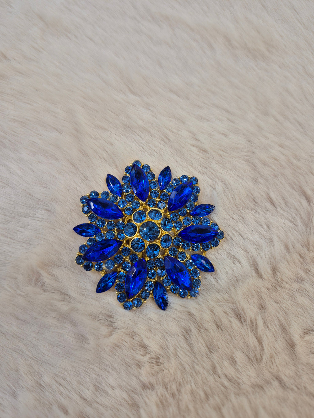 Diamante flower brooch in blue